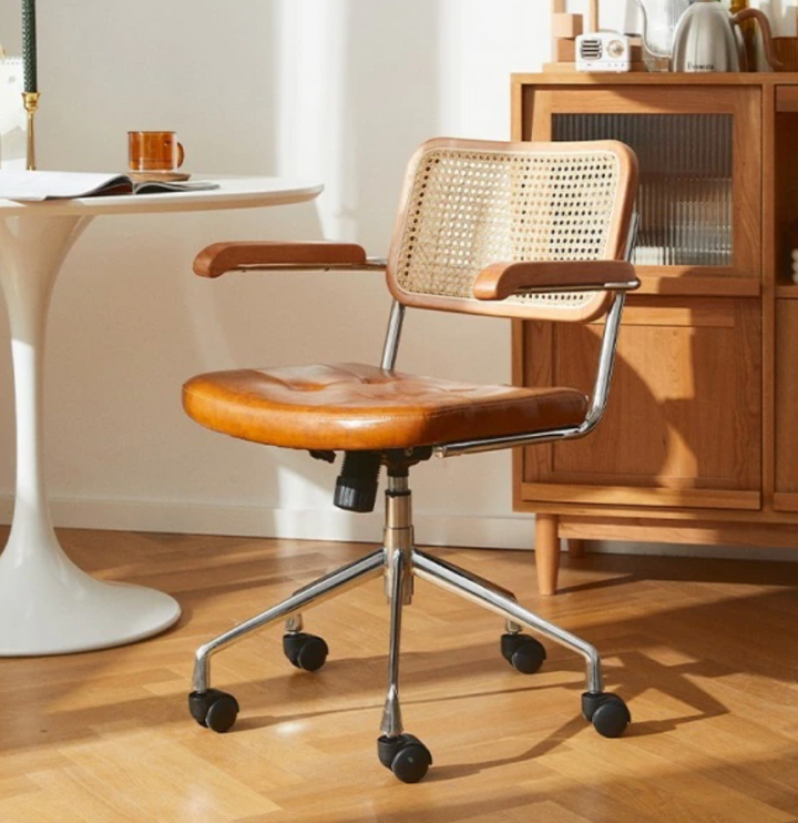 Rattan leather office chair with rollers.